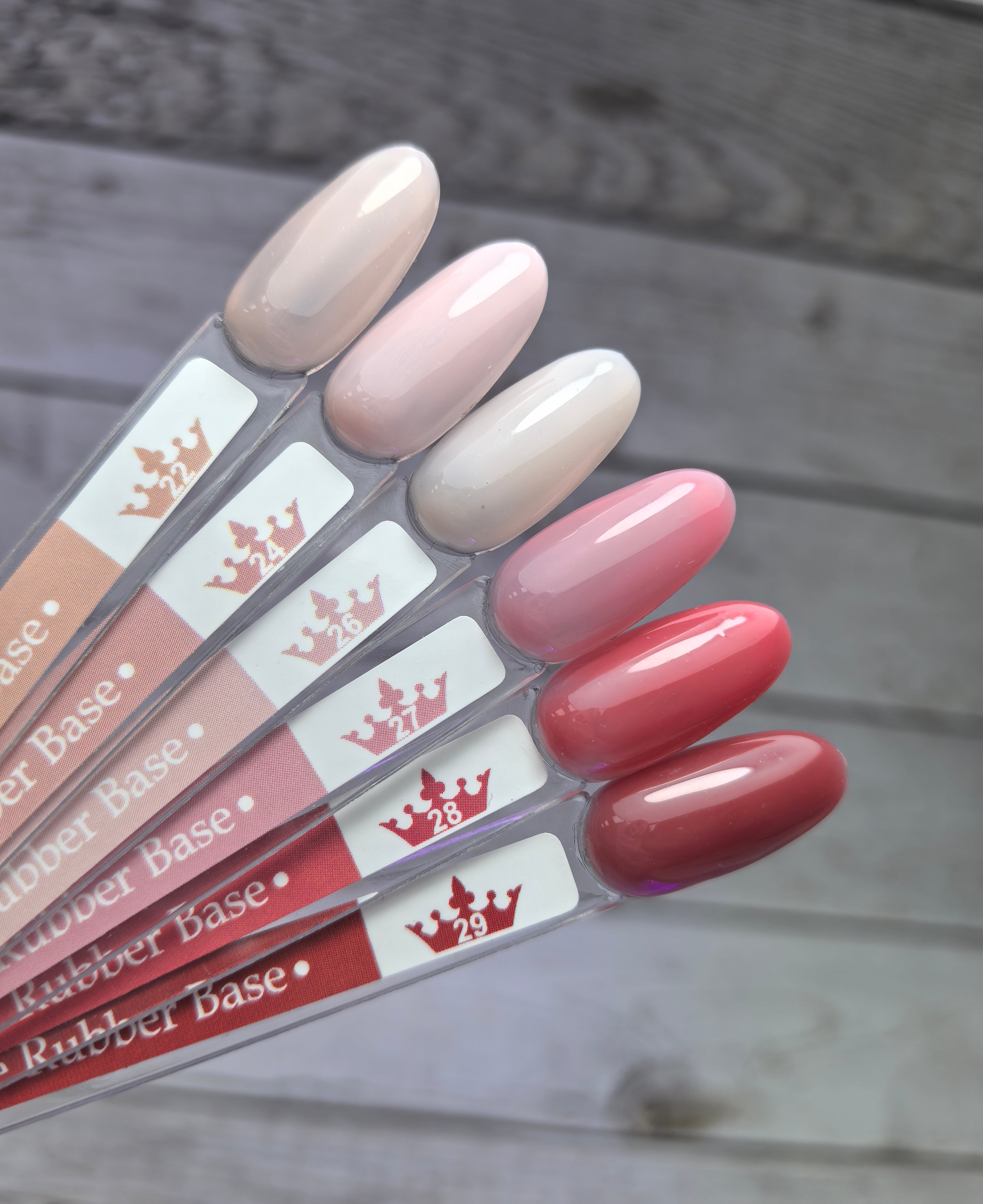 Nude Rubber Base 24 nail polish samples displayed on color palette for manicure.