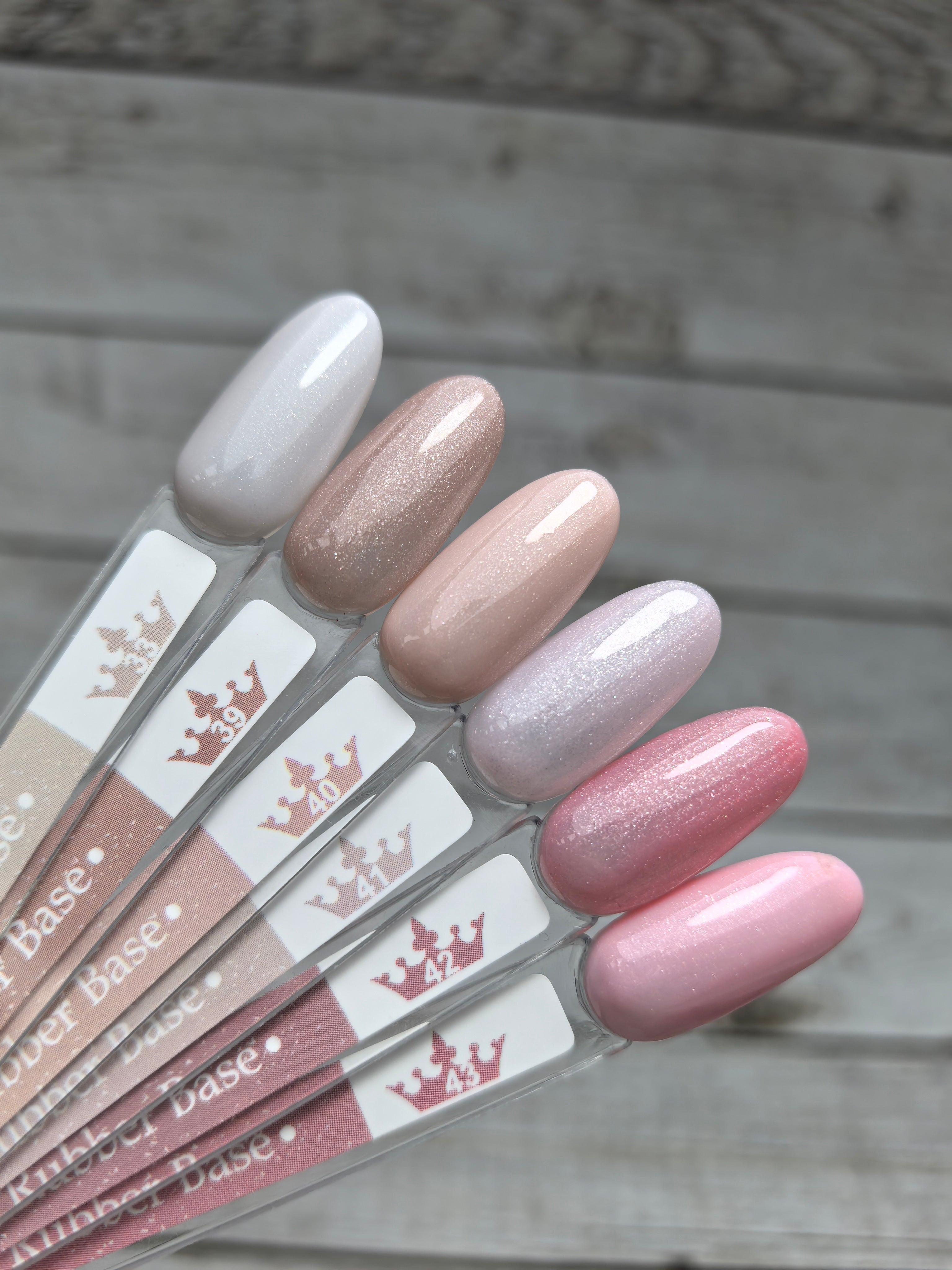 Nude Rubber Base 42 color samples in various shades for nail enhancement and strengthening with medium viscosity.