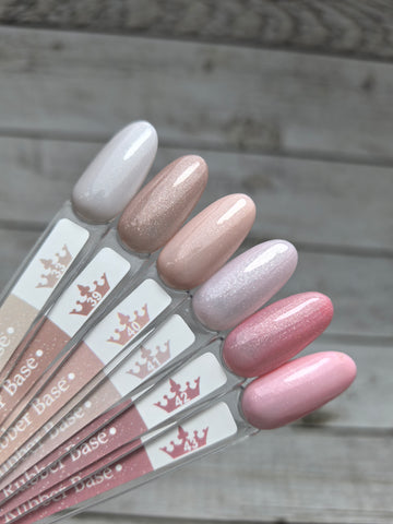 Nude Rubber Base 42 color samples in various shades for nail enhancement and strengthening with medium viscosity.