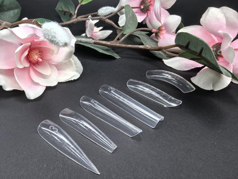Горни форми - Salon Expert displayed with delicate pink flowers on a black background, showcasing nail art templates.